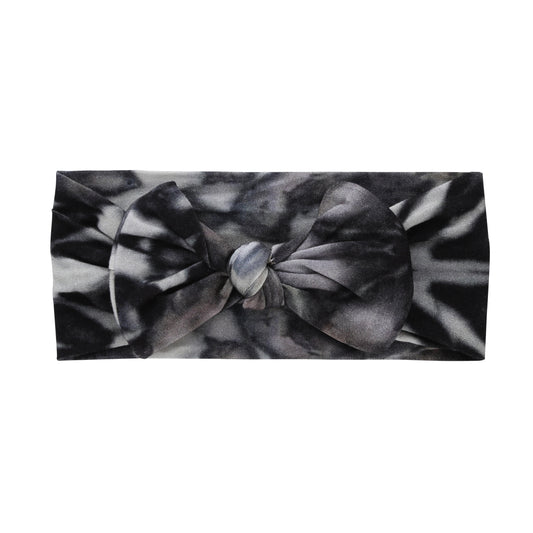 A soft bamboo knotted headband in black and white tie dye print.